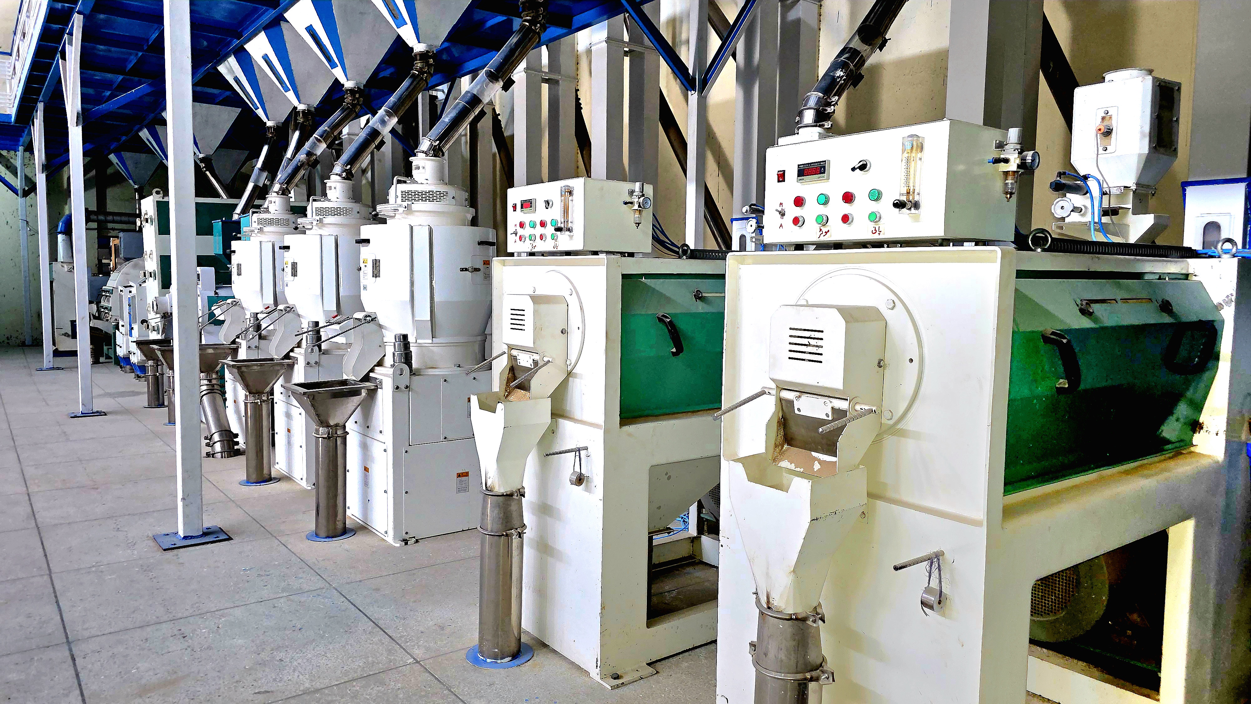 Processing and grading machinery inside the rice mill.